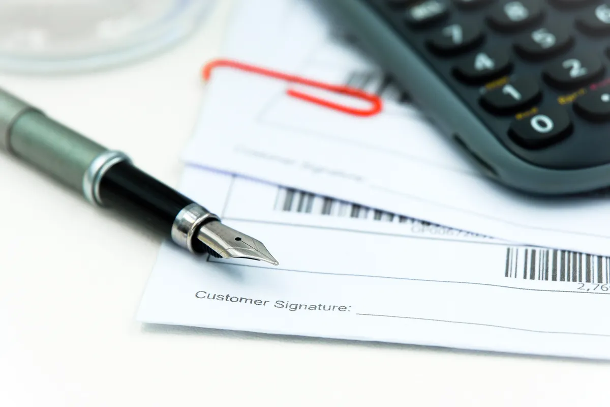 Business owner reviewing bank statements for mortgage qualification
