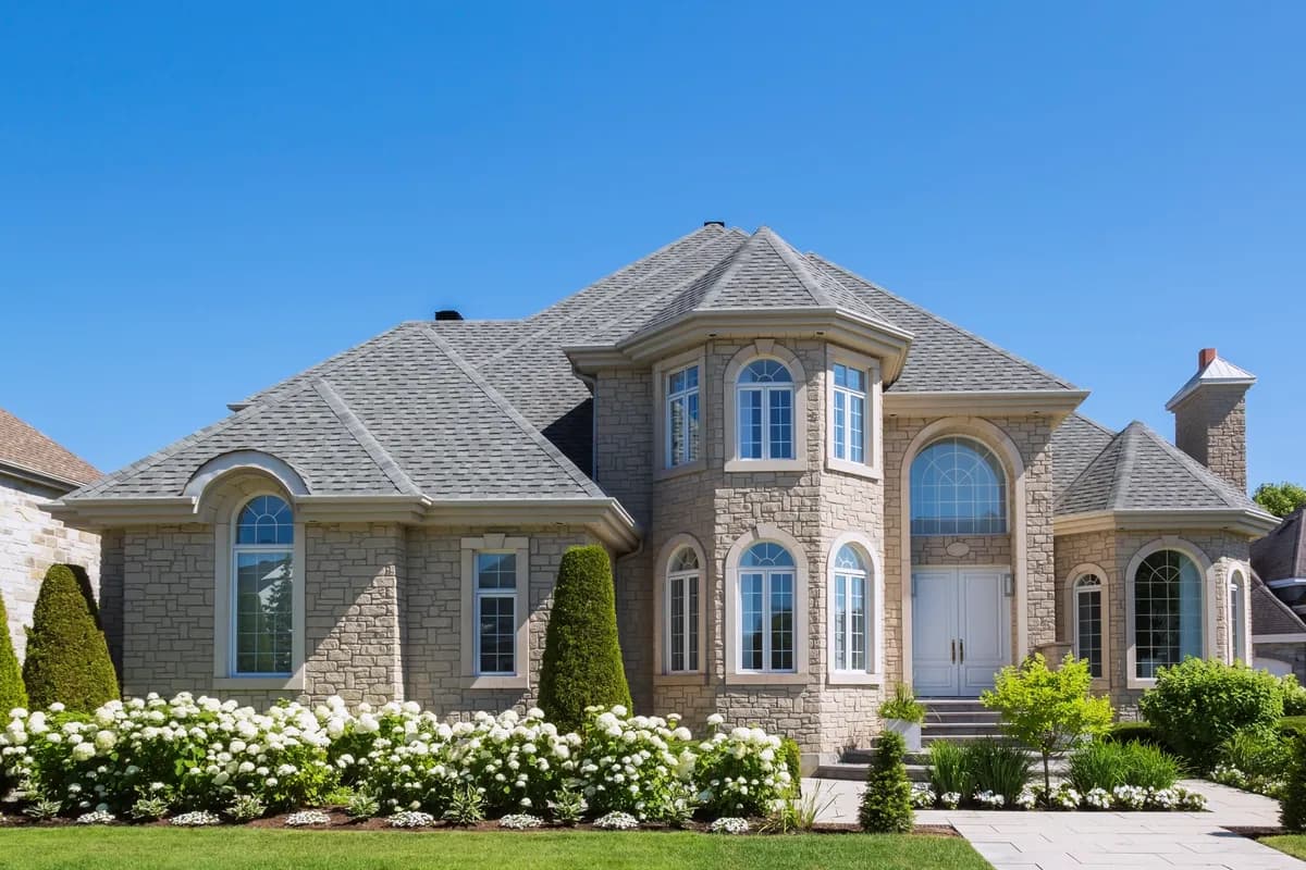 High-end home exterior at dusk — the jumbo market beyond agency limits